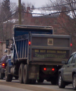 This truck drives by the highway with the brazen solicitation of "We Buy Stone Walls."